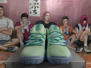 Front view of the pair showing the lace-up construction, blue-edged lace guards, and Kyrie details on the forefoot.