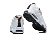 Rear and outsole views of Nike Air Max 95 TT sneakers.