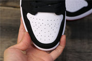 Perforated white toe panel framed by black overlays.