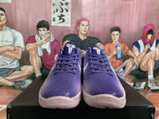 Front view of purple gradient Nike basketball sneakers with textured uppers, tonal laces and pale pink outsoles.