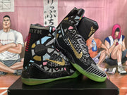 Angled view of the pair highlighting the gold branding, graphic side panels, patterned uppers, and high-top construction.