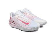 Three-quarter view of the pair of white and pale pink Nike Precision 7 basketball shoes.