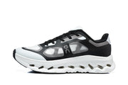 Side profile of a black and white On Cloudtilt Remix sneaker.