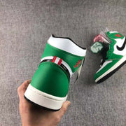 Rear view showing the green heel panel, white collar, and black outsole edge.