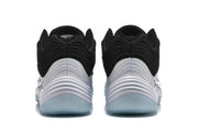 Rear view of the black and white Nike sneakers showing layered heel detailing and translucent outsoles.