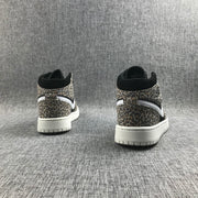 Rear view of the pair showing leopard-print heel panels, black collars, white Swoosh accents, and white outsoles.