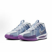 Pair of light blue and lavender Nike basketball sneakers with purple outsoles.