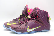 Pair of burgundy high-top basketball sneakers shown from a front three-quarter angle.