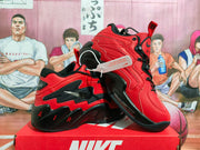Angled view highlighting the layered side panels, black outsole, red pull tabs, and high-top shape.