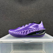 Side view of an electric purple Nike basketball sneaker with black midsole detailing and a visible Swoosh.