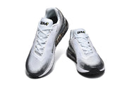 Top view of a pair of white and black Nike sneakers with white laces.