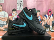Pair of black sneakers displayed together, showing Tiffany blue side logos, textured overlays, and glossy heel accents.