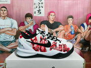 Side view highlighting the black swoosh-style branding, red illustrated graphics, and layered white midsole.