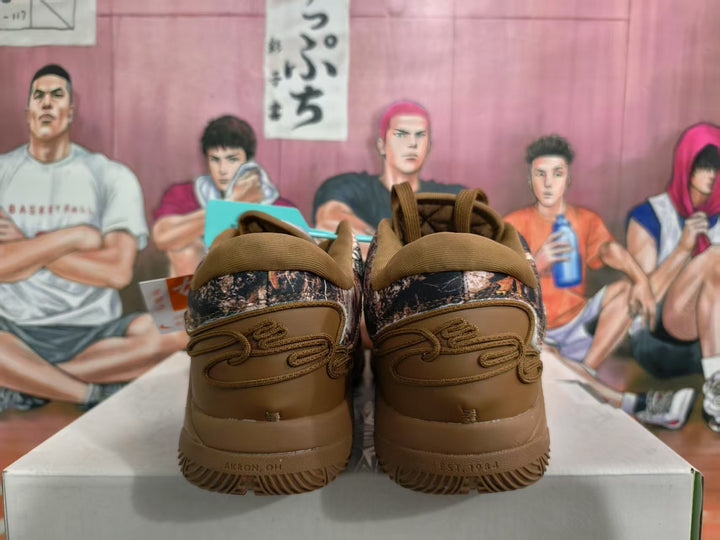 Rear view of brown Nike sneakers with camouflage-patterned heel panels, tonal laces and textured outsoles.
