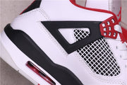 Close-up of the black side wing, white mesh insert, and red lace hardware.