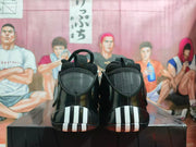 Rear view of black sneakers with contrasting light-colored heel accents