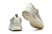 Rear and outsole views of beige and grey Louis Vuitton sneakers.