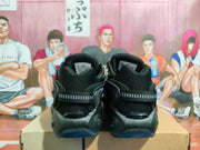 Rear view of the black sneakers showing mesh heels and heel straps
