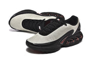 Angled top and side view of Nike Air Max DN sneakers.