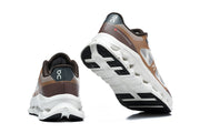 Rear and outsole views of the On Cloudtilt Remix sneakers