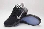 Angled view of a Nike Kobe 11 shoe showing the patterned Swoosh and outsole