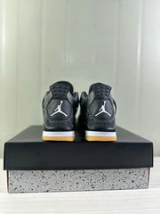 Rear view of a pair of black Jordan Air Jordan 4 sneakers with white heel logos, tonal detailing, white midsoles, and gum-colored outsoles.