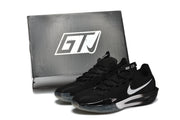 Black Nike G.T. Cut 3 basketball shoes with white Swoosh logos and translucent outsoles, shown beside a shoe box.
