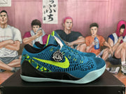 Side view of blue and black Nike basketball sneakers with bright green swooshes and patterned heel panels.