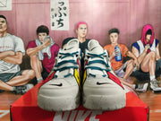 Front view of white Nike basketball shoes with teal laces, black swooshes, and colorful accents.