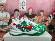 Side view showing the red Swoosh, patterned green upper, white midsole, and green outsole.