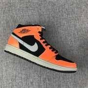 Angled view highlighting the orange panels, black sections and grey Swoosh.