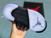 Outsole view showing the white translucent rubber sections, black center panel, and Jordan branding.