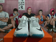 Front view of a pair of white high-top basketball shoes with black Swoosh details and blue-toned outsole accents.