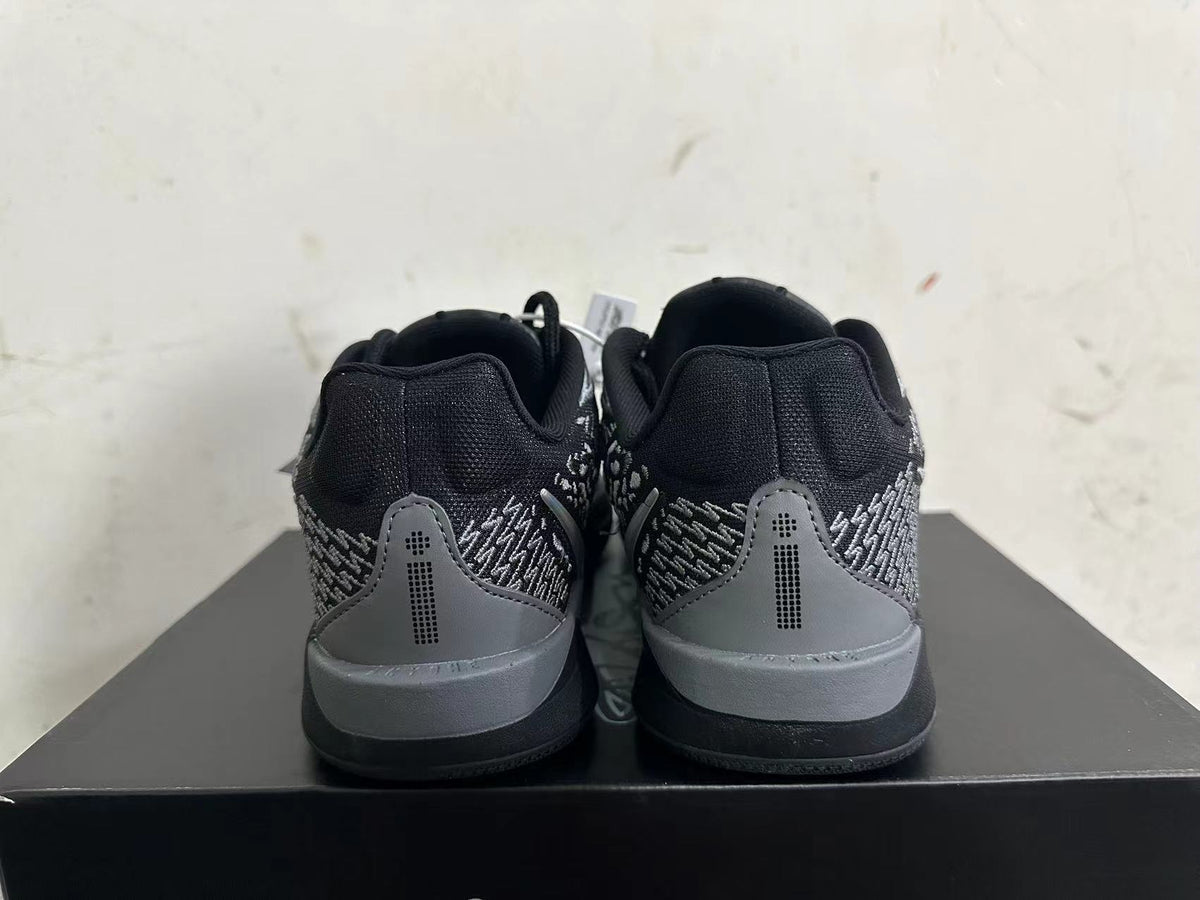 Rear view of black and grey low-top Nike Kobe basketball shoes