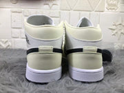 Rear view of the pair showing cream ankle collars, heel panels, black accent bands, and white midsoles.