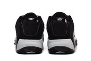 Rear view of the black sneakers showing gray midsoles, black outsoles, and heel branding.