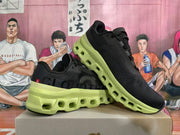 Pair of black sneakers with lime-green soles, shown at an angle