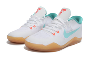 Pair of white and teal Kobe 11 shoes viewed from the front