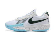 Side profile of a white basketball shoe with a dark green Swoosh, light blue outsole accents, and speckled midsole.