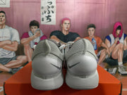 Rear view of a white Nike sneaker pair showing textured collars, heel panels, and dark Swoosh logos.