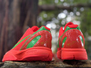 Rear view of Nike Kobe 6 shoes with green heel panels and Kobe signatures