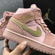 Close-up of the olive-green Swoosh, Jordan Wings branding, stitching, and textured outsole.