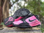 Pair of shoes with one outsole visible, showing the tread pattern