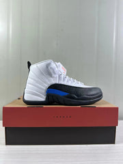 Side profile of one sneaker displayed on a Jordan shoe box.