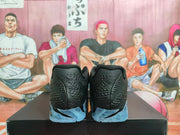 Rear view showing the textured black heels, Nike branding, and blue outsole sections.