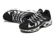 Pair of black and white Nike Air Max TN Plus sneakers shown from above and at the side
