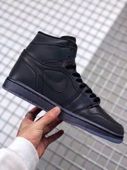Side profile of the black high-top sneaker with black laces, perforated toe, and textured midsole.