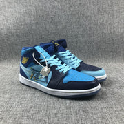 Three-quarter view of the pair showing light-blue laces, perforated toe boxes, graphic side panels and white midsoles.