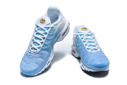 Pair of light blue and white Nike Air Max Plus sneakers viewed from the front.