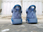 Rear view of the pair showing the heel pull tabs and embroidered Jordan branding.